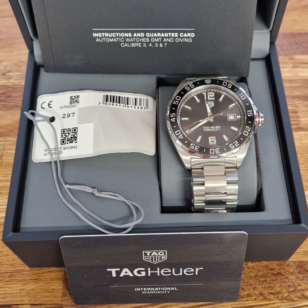 A pre-owned Tag watch in its box