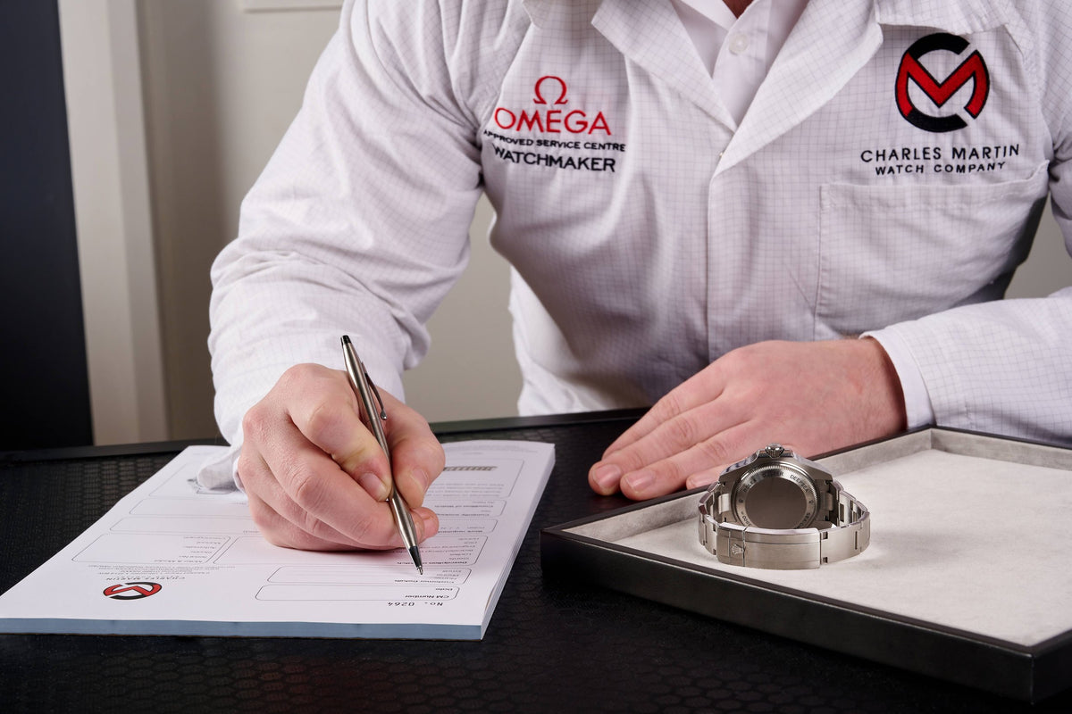 A Charles Martin technician completing a checklist inspection of a watch