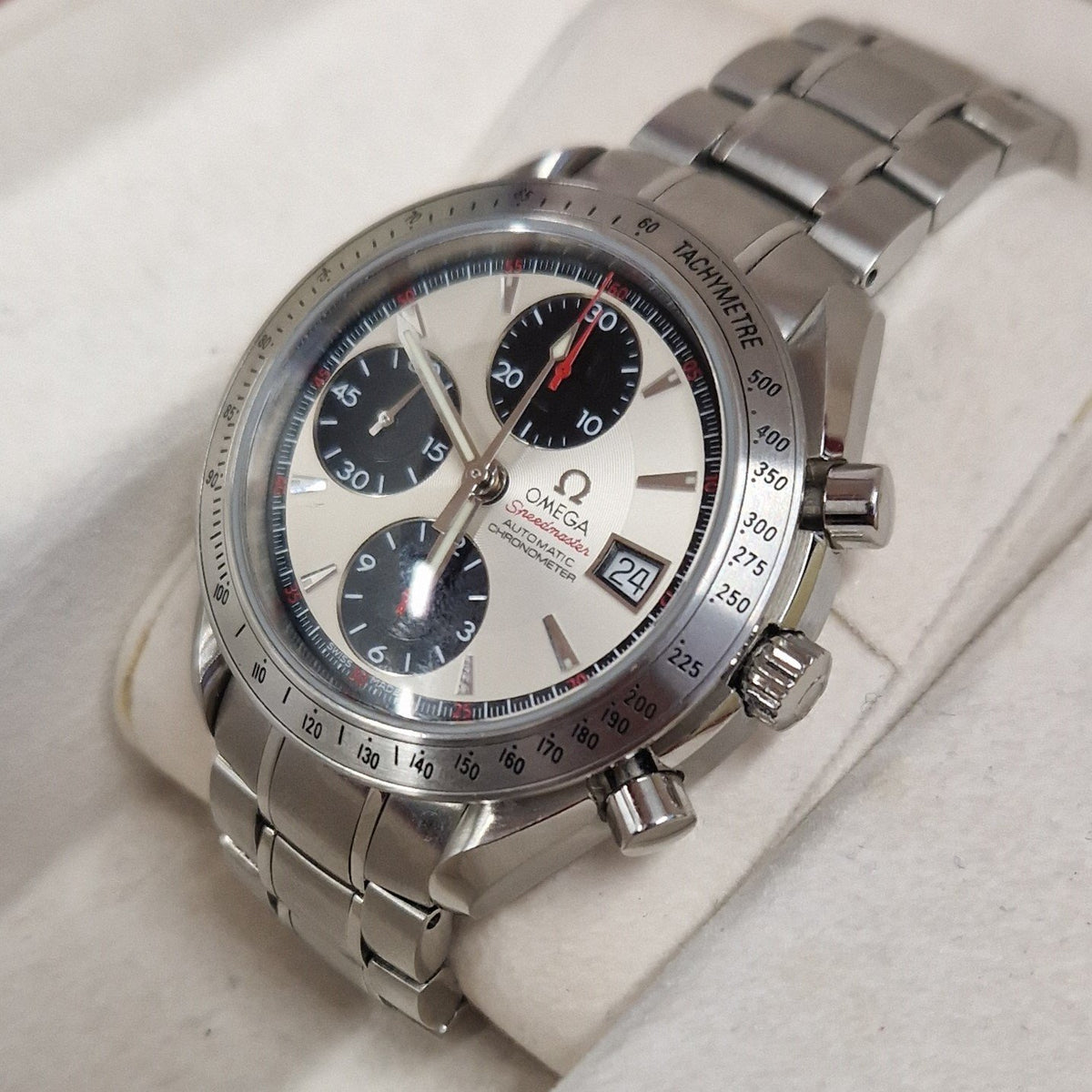 A close up of a Omega Speedmaster watch at Charles Martin Watches